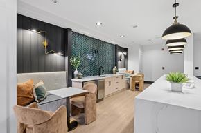 Atlanta apartment for rent - A modern kitchen with a dining table and chairs.