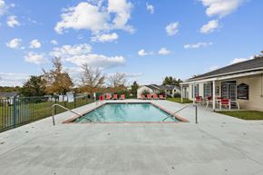 Dickson apartment for rent - A swimming pool in a backyard with a fence and trees.