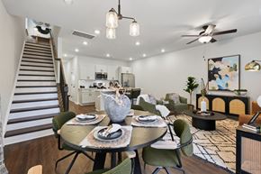 Charlotte townhouse for rent - A modern dining room with a round table set for two.