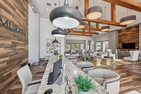 Orlando apartment for rent - A modern office space with a reception desk and comfortable seating areas.