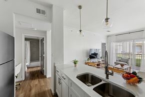 Austin apartment for rent - A kitchen with a white counter top and a bowl of fruit on it.