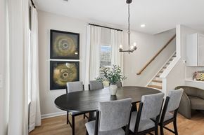 Braselton apartment for rent - A dining room with a black table and chairs.