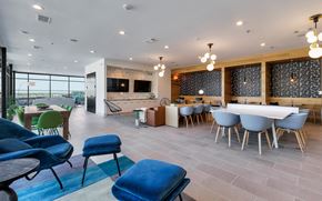 Austin apartment for rent - A modern dining room with a long table and chairs.