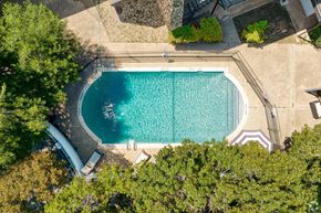 Austin apartment for rent - Ariel View of sparking pool surrounded by trees