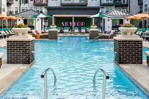 Cincinnati apartment for rent - A pool with a sign that says "SKYTOP" behind it.