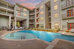 Farmers Branch apartment for rent - a swimming pool in the middle of an apartment building