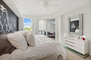 Boca Raton apartment for rent - a bedroom with a large bed and a white dresser