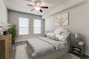 Highland Village apartment for rent - a bedroom with a bed and a ceiling fan