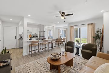 Tulsa apartment for rent - A living room with a brown coffee table and brown leather couch.
