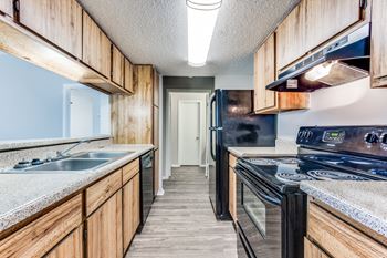 Stylish gray or wooden shaker-style cabinets with sleek stainless steel pulls*