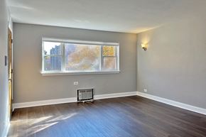 Oak Park apartment for rent - an empty room with a window and wooden floors