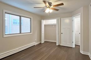 Forest Park apartment for rent - A room with a ceiling fan and a window.
