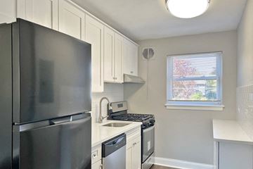 Oak Park apartment for rent - a kitchen with stainless steel appliances and white cabinets