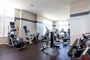 Merrillville apartment for rent - A gym with a variety of equipment including weights and cardio machines.