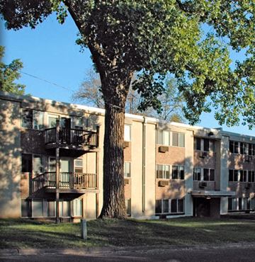 St Paul apartment for rent - an apartment building with a tree in front of it