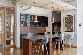 St Paul apartment for rent - a kitchen with a long counter and chairs