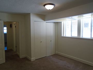 St Paul apartment for rent - an empty living room with white walls and a window