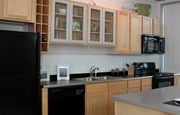 St Paul apartment for rent - a kitchen with black appliances and wooden cabinets