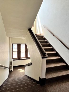 St Paul apartment for rent - a view of the stairwell from the top of the stairs