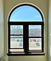 St Paul apartment for rent - an arched window with a view of a parking lot