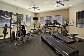 Las Vegas apartment for rent - A spacious gym with a variety of equipment including treadmills, elliptical machines, and weight machines.