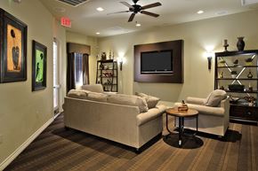 Las Vegas apartment for rent - A living room with a couch, a chair, and a television.