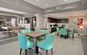 Henderson apartment for rent - A modern dining room with a table set for six.