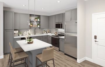 Kissimmee apartment for rent - A modern kitchen with a dining table and chairs.