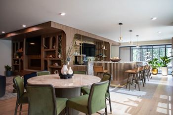 Open plan dining area with bar seating and kitchen