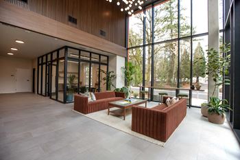 Double height lobby with floor to ceiling windows