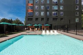 Tigard apartment for rent - A large swimming pool with lounge chairs at Montage Apartments, Tigard, Oregon