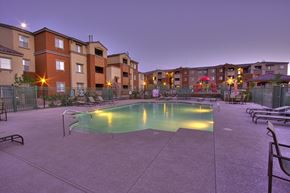 Las Vegas apartment for rent - A swimming pool in a courtyard surrounded by apartment buildings.