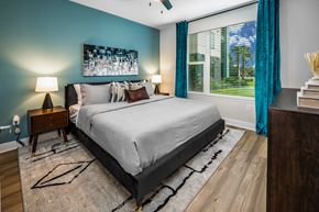 Ocoee apartment for rent - Bedroom with bed and large window at The Alibi at Lake Lilly, Ocoee, FL, 34761