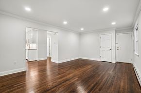 West Caldwell apartment for rent - A room with wooden floors and white walls.