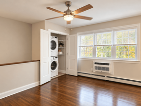 Aberdeen apartment for rent - A room with a ceiling fan and a washer and dryer in the doorway.