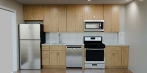 Ridgewood apartment for rent - A kitchen with wooden cabinets and stainless steel appliances.