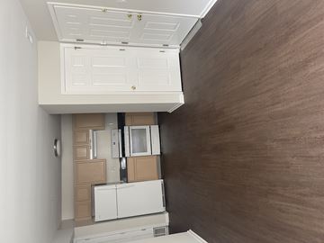 Wayne apartment for rent - A kitchen with brown walls and white cabinets.