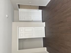 Wayne apartment for rent - A white cabinet with a shelf is mounted on a wall.