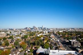 Denver apartment for rent - A cityscape with a clear blue sky above. at Denver Metro Village Apartments, Denver, 80204