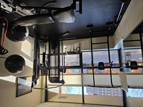 Madison apartment for rent - A gym with a view of the city outside the window.
