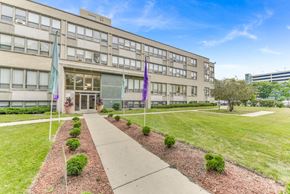 Chicago apartment for rent - A building with a walkway in front of it. at Academy at Drexel Apartments, Chicago, Illinois