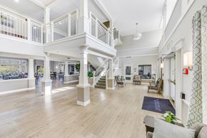 Temple Hills apartment for rent - A spacious living room with a staircase and a balcony at Manor at Victoria Park, Temple Hills, MD 20748