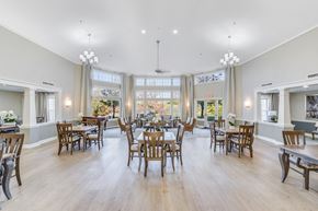 Temple Hills apartment for rent - A large dining room with wooden chairs and tables at Manor at Victoria Park, Temple Hills, MD