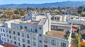 Berkeley apartment for rent - A large white building with a balcony overlooking a city. at Acton Courtyard, California