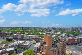 Brooklyn apartment for rent - A cityscape with buildings and a clear sky.