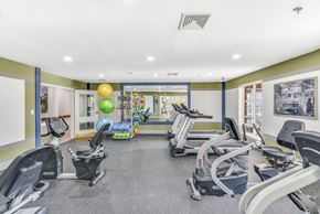 Temple Hills apartment for rent - A gym with treadmills, exercise bikes, and elliptical machines at Manor at Victoria Park, Temple Hills, 20748