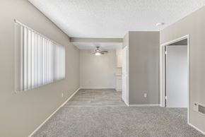 Duarte apartment for rent - Empty living area with laminate and carpet flooring at Heritage Park Apartments, Duarte