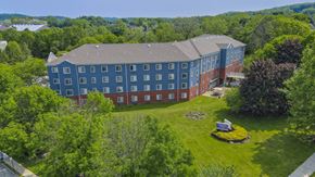 Wharton apartment for rent - Aerial view of colorful apartment community with landscaping at Centennial Court Apartments, Wharton, NJ 7885