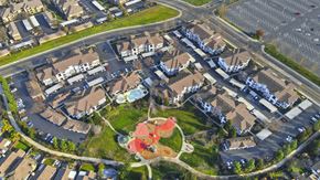 Elk Grove apartment for rent - A bird's eye view of a residential area with houses and a playground.