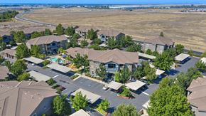 Rocklin apartment for rent - Aerial view of apartment community with pool and parking at Whitney Ranch Apartments, California